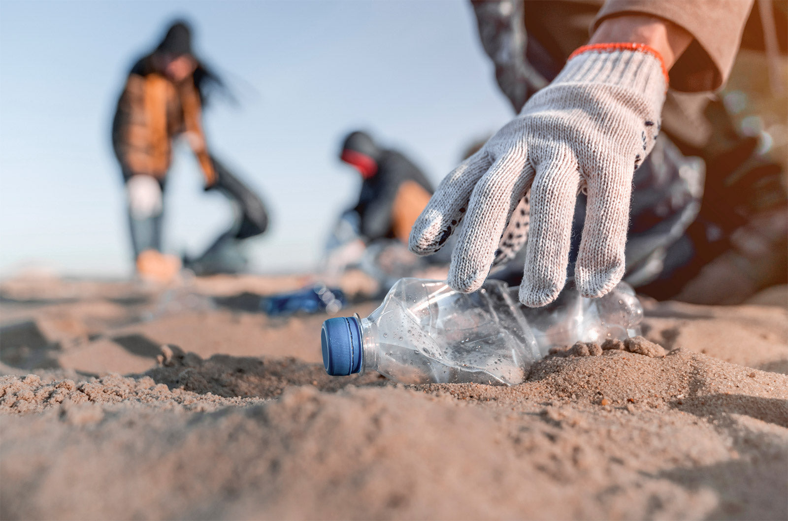 collecting waste plastic on the beach to recycle